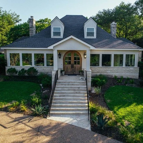 a home with a shingle roof