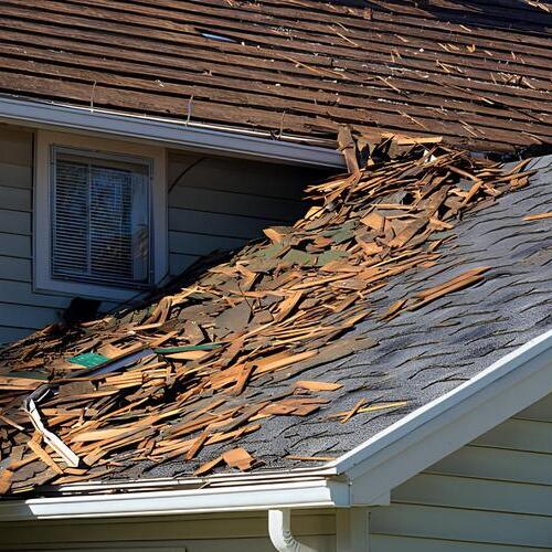 a roof covered in debris after a storm