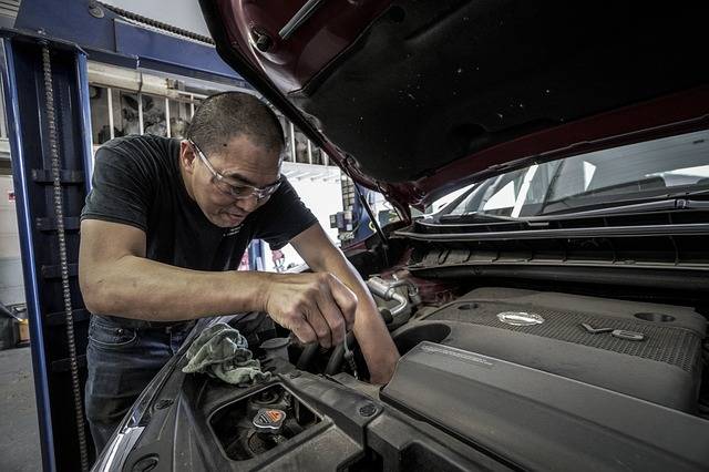 man doing an oil change