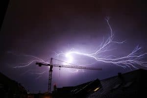 Lightning striking in the night sky